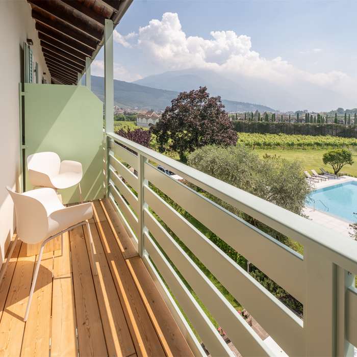 comfort room with balcony and pool view